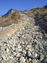 The soil on this steep stretch of Cornfield Spring Road has eroded over decades, leaving just a trail of rocks