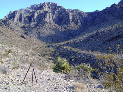 Cornfield Spring Road's final switchback takes me up a hill and around a bend to this tripod-like end-of-road marker