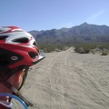 I mount the bike and ride the 1/4-mile shortcut at the end of Kelso Dunes Road to the nearby power-line road