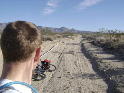 Heading up this sandy road, I notice a plastic pipe along the shoulder