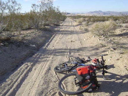 The soft sand on this road results in my walking the bike for about a mile, leaving nice tire tracks behind