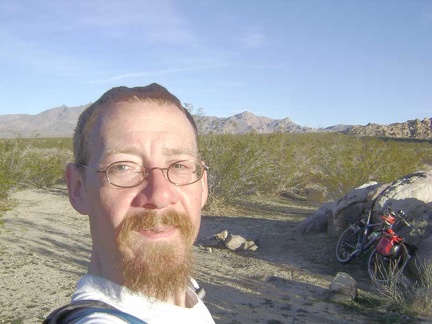 The road to Coyote Springs ends at a cul-de-sac, a small stone fire ring, and Wilderness-barrier posts