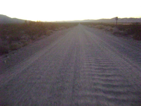 In the last vestiges of daylight, I rattle four miles down the Kelso Dunes Road washboard back to my tent