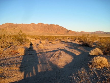 I ride down the faint road from the Old Dominion Mine site at sunset