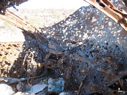 Apparently, this old car was once burned; the steering wheel looks quite melted and limp