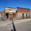 These two old commercial buildings in Daggett have been fenced off, perhaps with the hope of preserving them