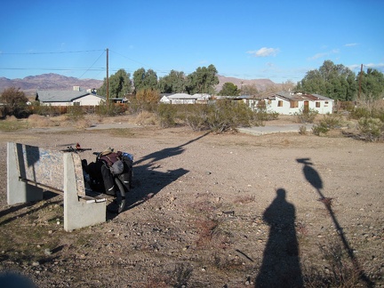 Before leaving Daggett, I stop at a forlorn park bench to change the batteries in my GPS