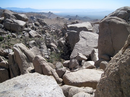 From this saddle in the Eagle Rocks, I look into the haze southwest across Mojave National Preserve