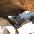 Rock-scrambling at Mojave National Preserve's Eagle Rocks can include scrambling under boulders, not just over them