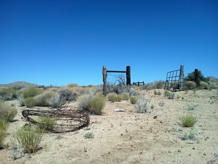 I pause briefly at the high point of Woods Wash Road to check out remnants of barbed-wire removal