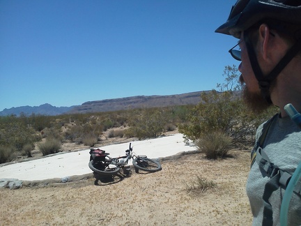 I go for a short ride up a side road, wondering where it leads, and it ends near a guzzler, which is dry today