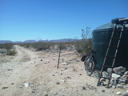 I pause to shoot photos at another water stop along the route, more cow shit everywhere of course!