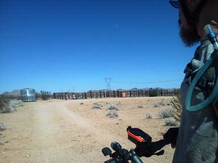 The road quickly gets better and I pass another functional corral just before I arrive at the powerline road