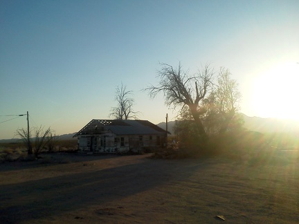 Across the road from the old Essex Café, an abandoned house awaits something