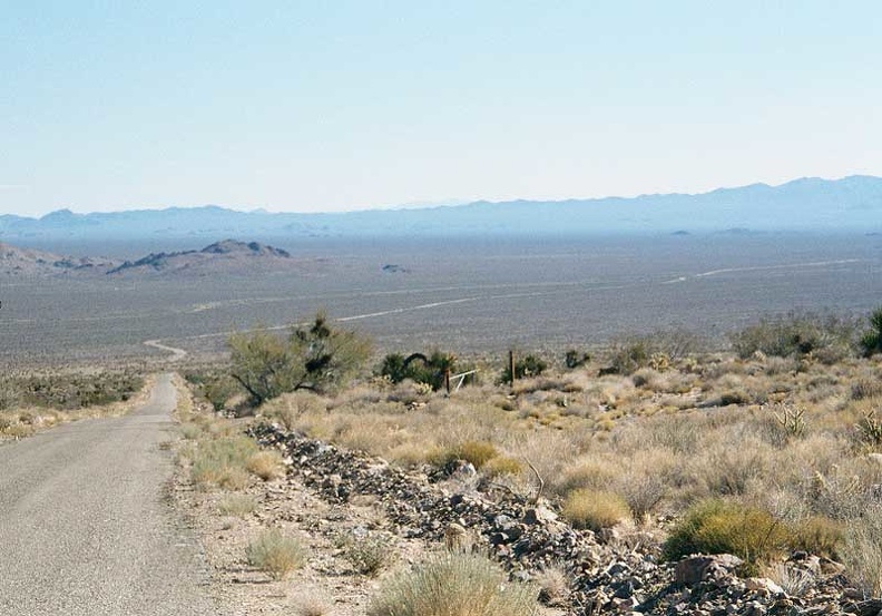 After breaking camp, I leave the Providence Mountains campground and coast down the hill to the desert floor on Essex Road