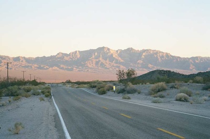 A beautiful sunset illuminates the Providence Mountains behind me as I climb Kelbaker Road out of Kelso Valley toward Baker