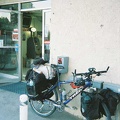 The 10-ton bike and its sore knee take a break at the Shoshone general store and gas station