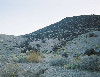 Black rocks that look like giant charcoal briquets