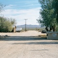 Looking southeast from the Essex post office, down Sunflower Springs Road, a dirt road that rises up over the mountains
