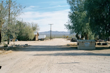 Looking southeast from the Essex post office, down Sunflower Springs Road, a dirt road that rises up over the mountains