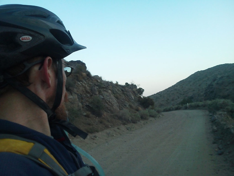 The sun starts to go down as Black Canyon Road winds its way through the pass