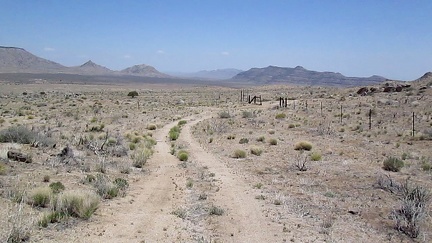 After some nice gentle rolling, Gold Valley Road passes through an old range fence into the next section