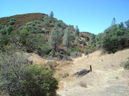 Bear Spring Road meanders through the grassland along the dry creek.