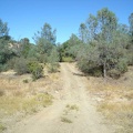 The road rises up away from the lake toward County Line Road and Board Spring.