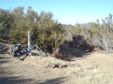 Board Spring Road veers off County Line Road into the brush in the middle of the photo on a slight downhill along the edge of the mountain.