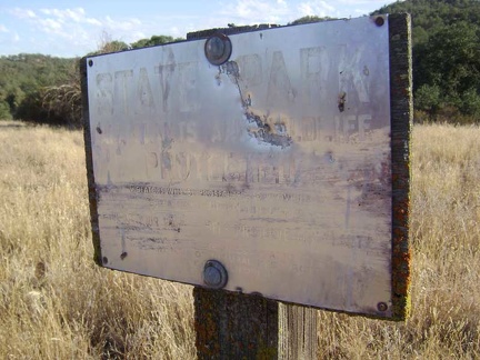 An old State Park boundary sign across the Paradise Flat meadow.