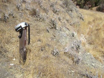 A canteen hangs on the sign indicating Canteen Trail.