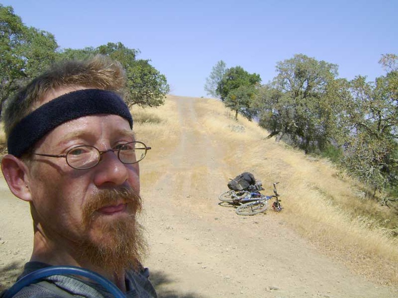 Hot and sweaty already, I park the 10-ton bike at the top of Coit Road and walk up the short hill to "Radio-tower Peak"