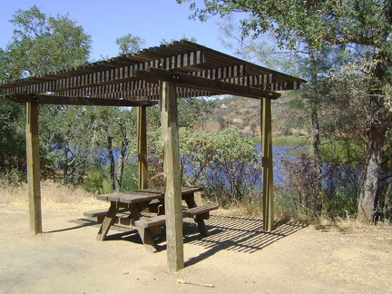 The ramada and picnic table at the south end of Coit Lake