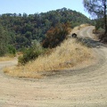 I rise out of the shady section and back into the hot sun at a tight switchback on Coit Road