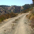 Coit Road rises along a ledge through chamise chaparral toward the Wasno Ridge area