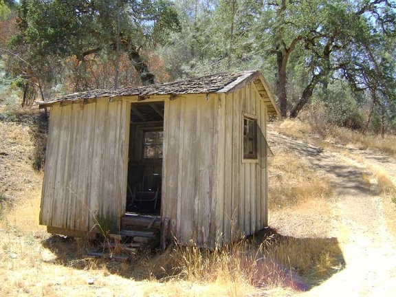 The old outhouse at Pacheco Camp (no longer used) sits near the more recent concrete outhouse a bit up the hill