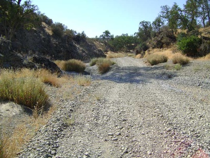 The gravel crunches beneath my tires on Orestimba Creek Road