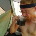 Drinking hot morning coffee in the hot morning tent