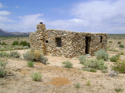 The Bert Smith Rock House sports deeply recessed windows and an unusual lack of a roof line