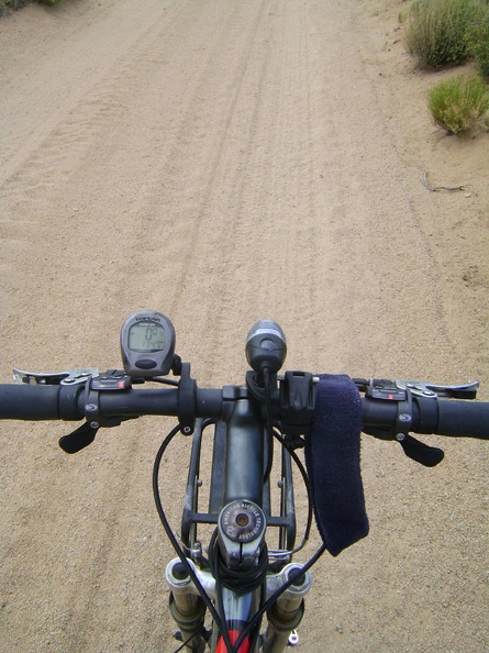 So far, west New York Mountains Road is well packed, but with a layer of sand or gravel on the surface