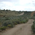 I ride briefly through the sagebrush in Watson Wash, then rise out of the wash after turning onto Cedar Canyon Road
