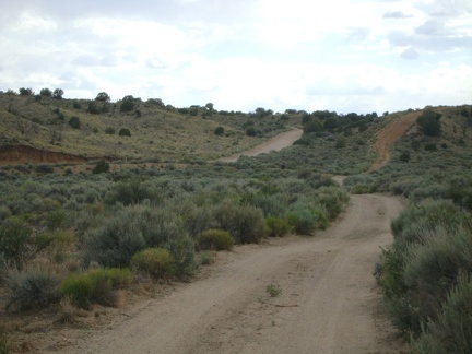 I ride briefly through the sagebrush in Watson Wash, then rise out of the wash after turning onto Cedar Canyon Road