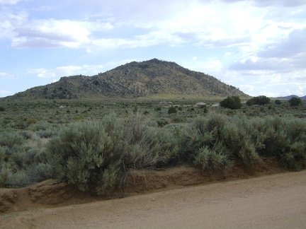 I stare at this unnamed mountain just south of Cedar Canyon Road while riding past it