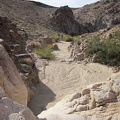 I climb up a small dry waterfall in Hyten Spring Wash and look back down