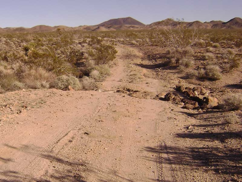 A drainage rut across Indian Springs Road