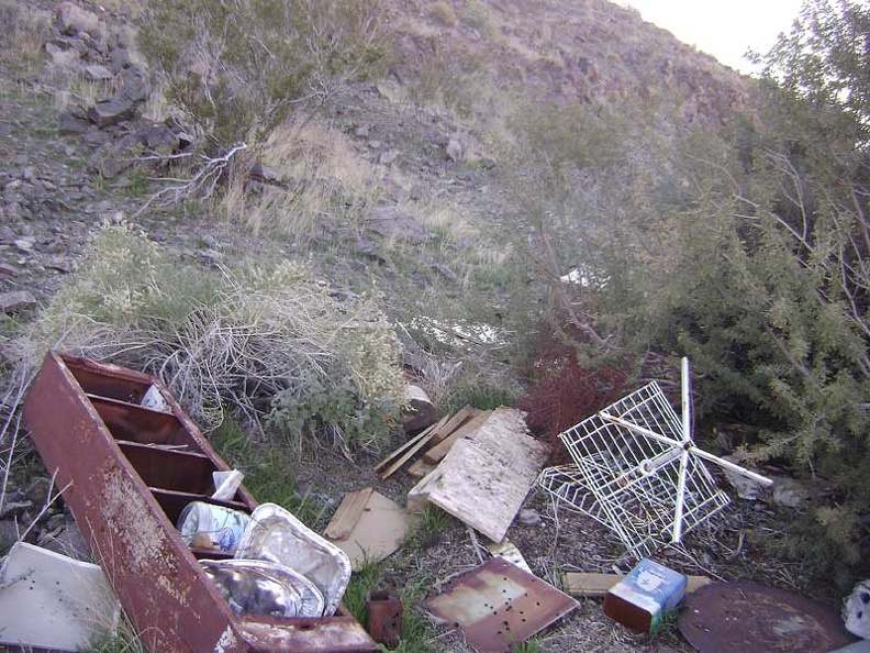 An ugly pile of debris sits on the hillside just above my chosen campsite near Indian Springs