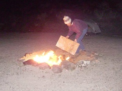 I add another piece of junk plywood to the fire