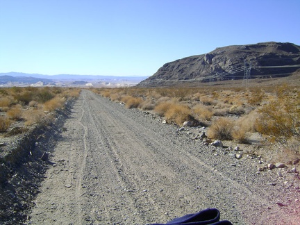 Nice wiggly tire track behind me as I ride slowly up Jackass Canyon Road from Devil's Playground