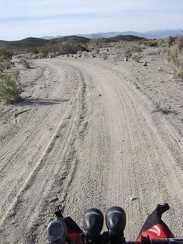 Around 13h, I ride down Indian Springs wash, away from my quiet campsite of the past two nights