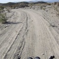 Around 13h, I ride down Indian Springs wash, away from my quiet campsite of the past two nights